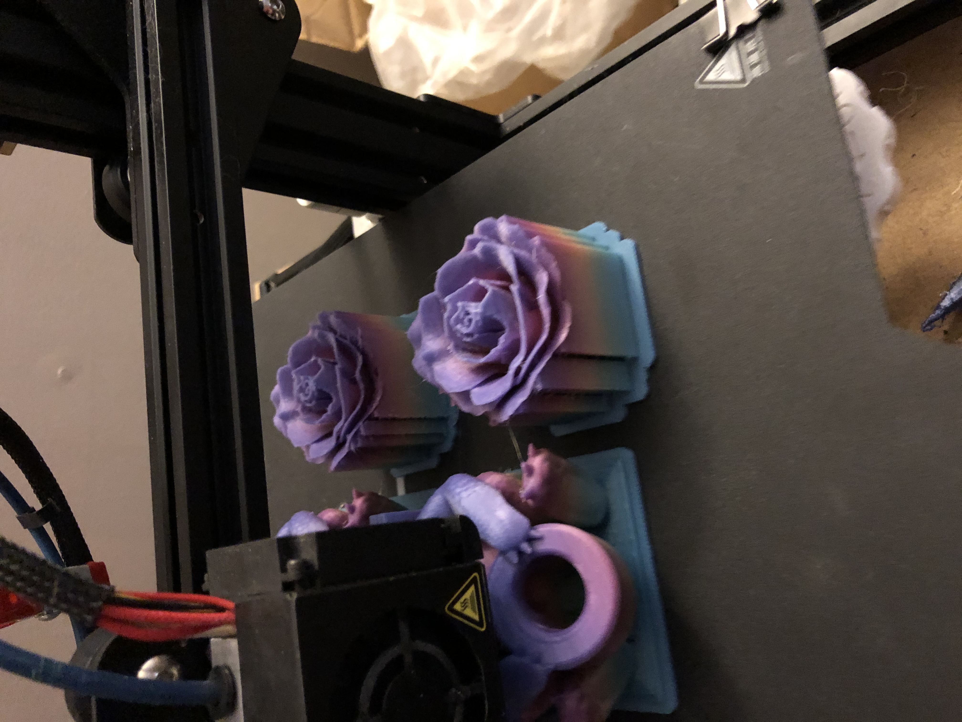 Rose buds and dragon pen holders on print bed